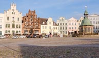 Thumbnail image of Market Square, Am Markt with the Wasserkunst fountain and Alter Schwede restaurant and hotel, Wismar