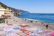 Beach At Monterosso With Colourful Beach Throws, Liguria, Italy