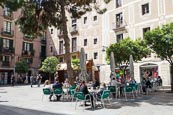 Thumbnail image of Placa del Pi in the Barri Gotic, people sitting outside the Cafe Osterhase beneath orange trees, Bar