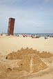 Thumbnail image of People on the beach at Barceloneta with Rebecca Horns sculpture  L’Estel Ferit (The Wounded Shooting