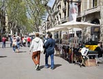 Thumbnail image of people walking on La Rambla by an artist stall, Barcelona, Catalonia, Spain