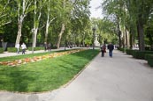 People Walking On The Avenida De México In Buen Retiro Park, Madrid, Spain