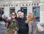 Thumbnail image of Kim Jong Un impersonator at Checkpoint Charlie, Berlin