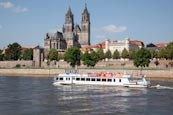 Thumbnail image of tourist boat on the River Elbe with the Cathedral and Fürstenwall, Magdeburg, Saxony Anhalt, Germany
