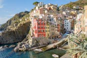 Thumbnail image of view over the town and harbour with its colourful houses in Riomaggiore, Cinque Terre, Liguria, Ital