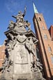 Statue St John Of Nepomuk And Church Of The Holy Cross, Wroclaw, Poland